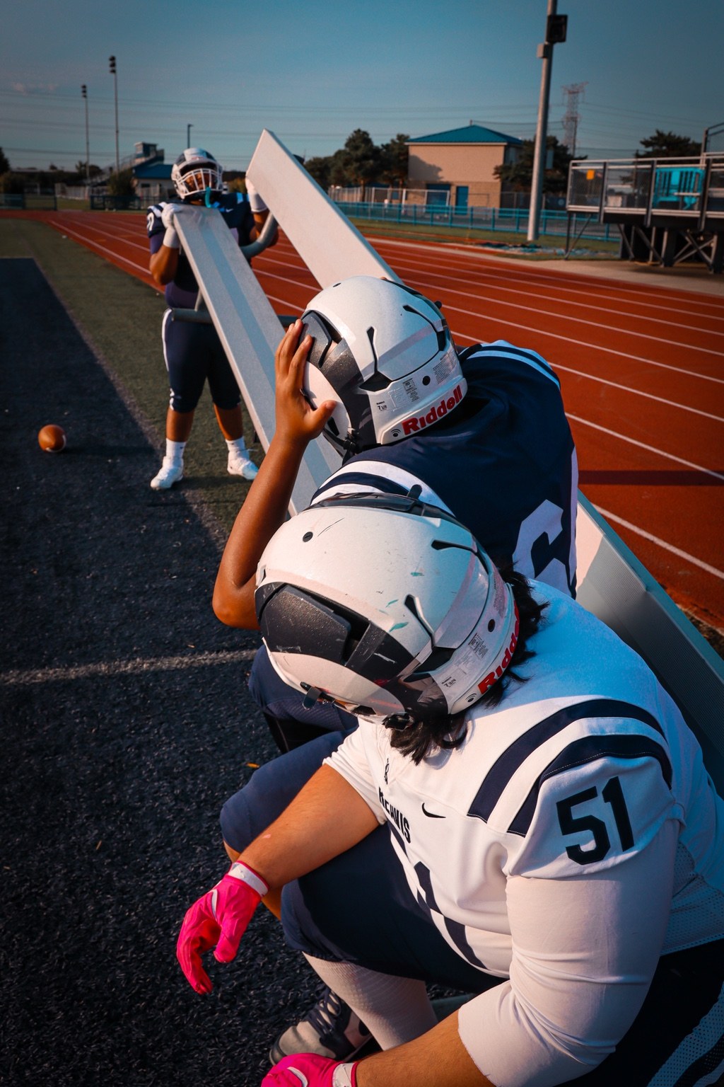 Football players by the sideline