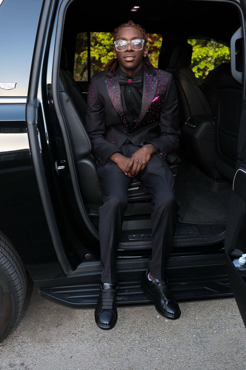 Formal portrait seated in a vehicle